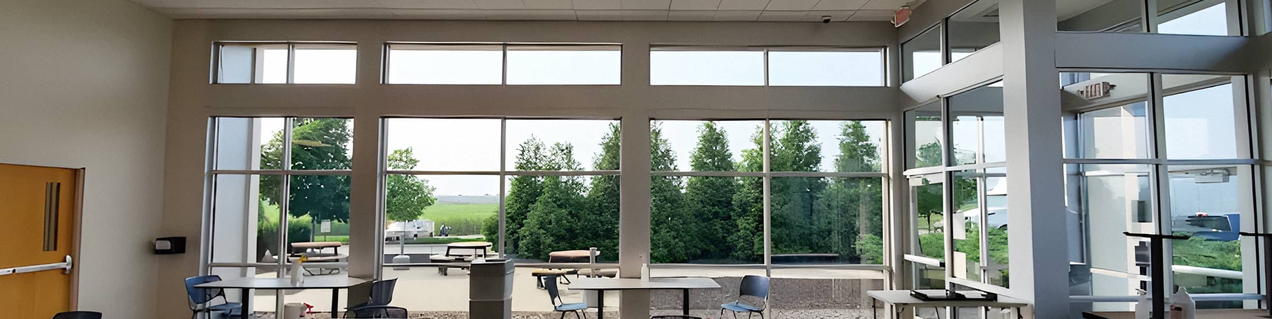 a hall of crystal clear floor to ceiling windows